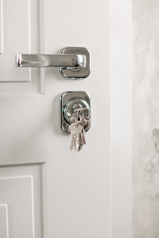 keys inserted in the lock of a door