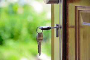 A key is placed in a door lock.
