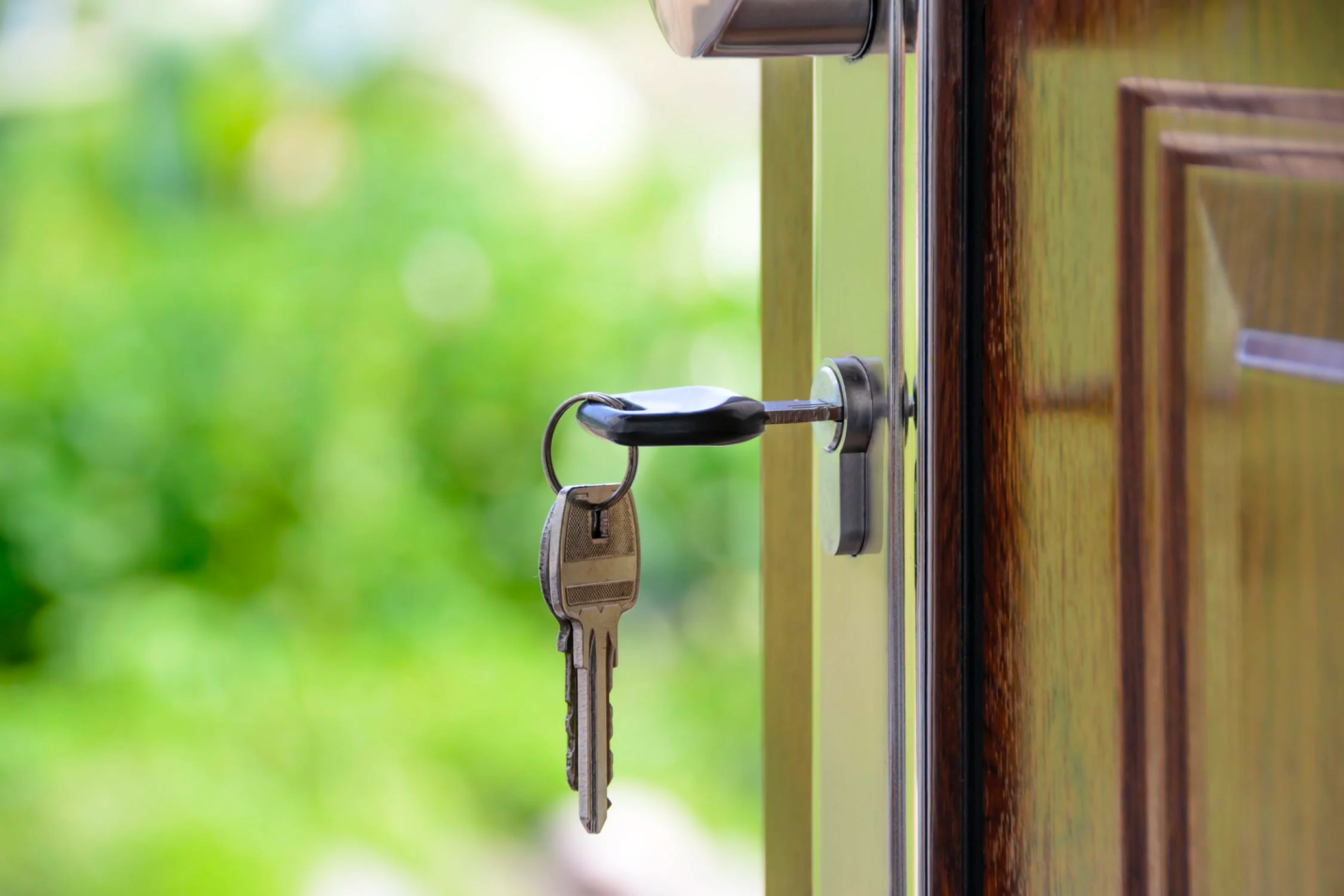 A key is placed in a door lock.